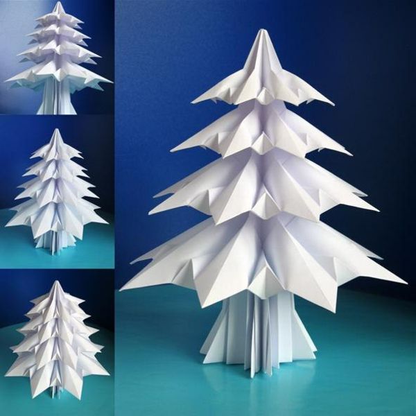 origami-till-jul-vit-vackra-gran-träd - bakgrund i blå färg