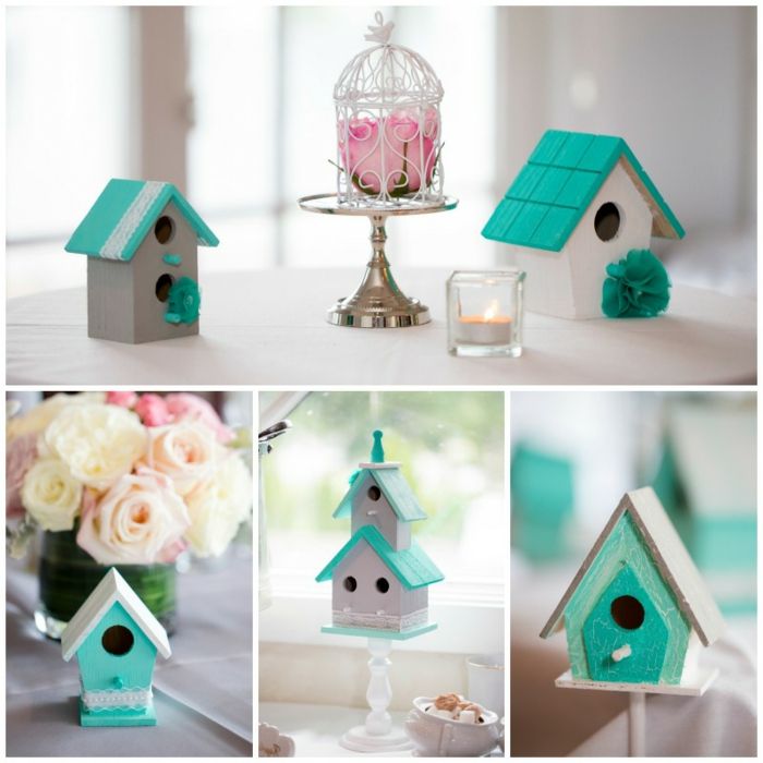 piccole casette per uccelli in legno, dipinte di bianco e turchese, decorate con pizzi, fiori artificiali e candele profumate