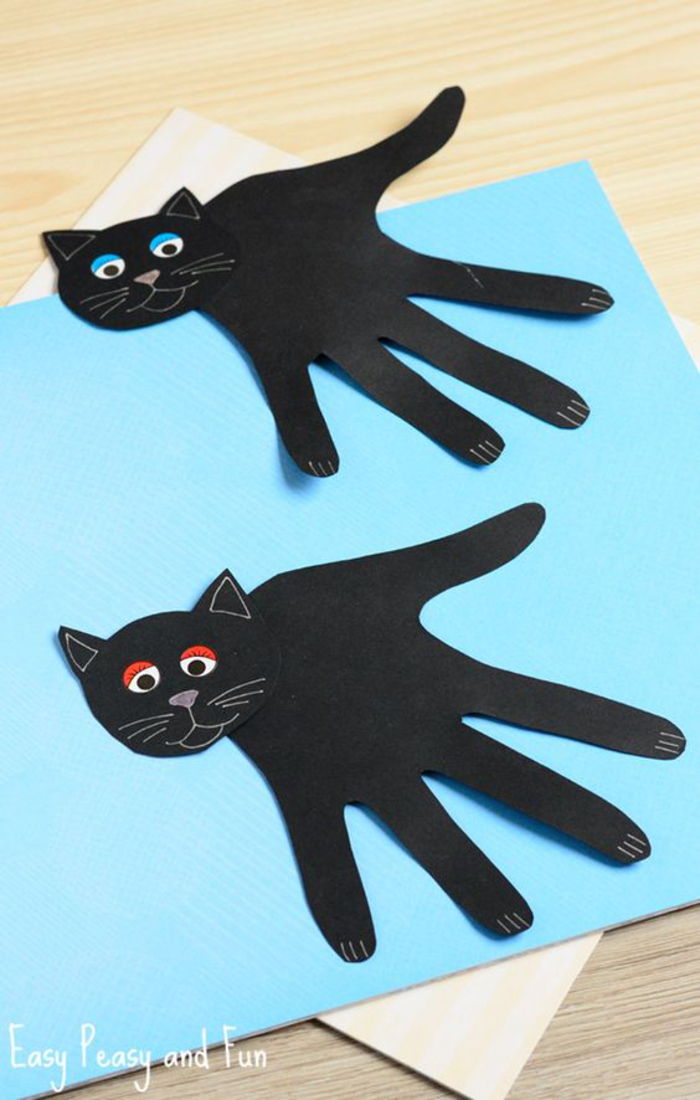 DIY nápady pre deti, čierny papier remeselnícky papier, handprint ako mačacie telo