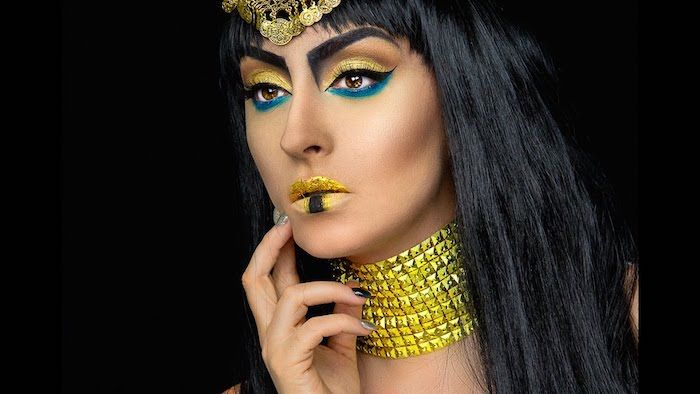 Cleopatra kostymer gul gyllene smink och prydnadar blå ögonskugga