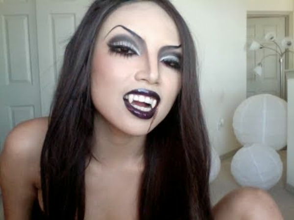 upír - make-up-halloween - mladá žena s čiernymi perami