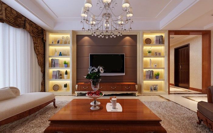 TV veggpanel elegant lampe henger fra taket hjemme design stor bord sofa hyller belysning lyse hyller bøker tv