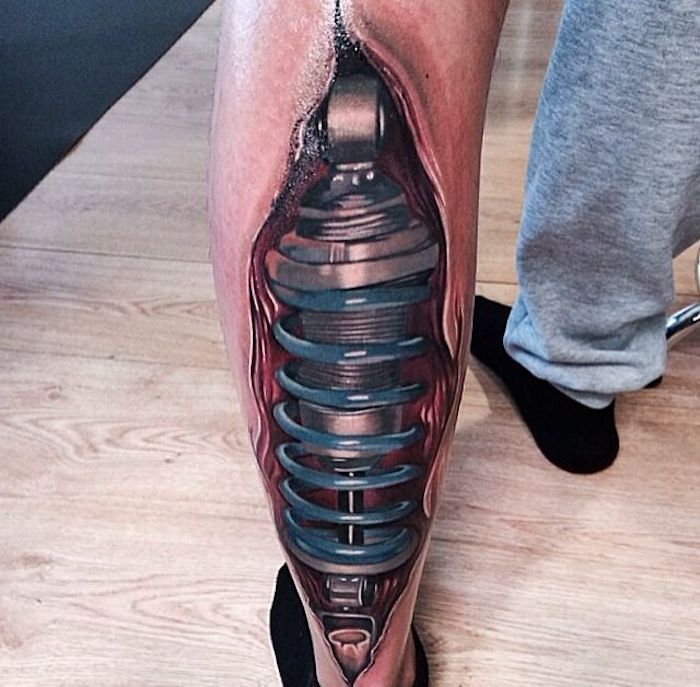 tatuagens de homens, tatuagem com peças de máquina na perna