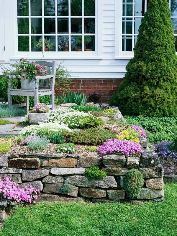 design de jardim verde com pedras - para uma bela casa branca