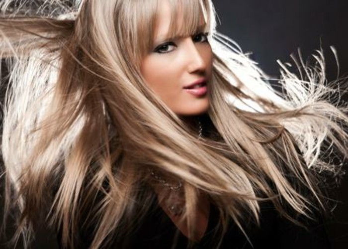 beautiful-woman-with-dark-blond-hair-black-background